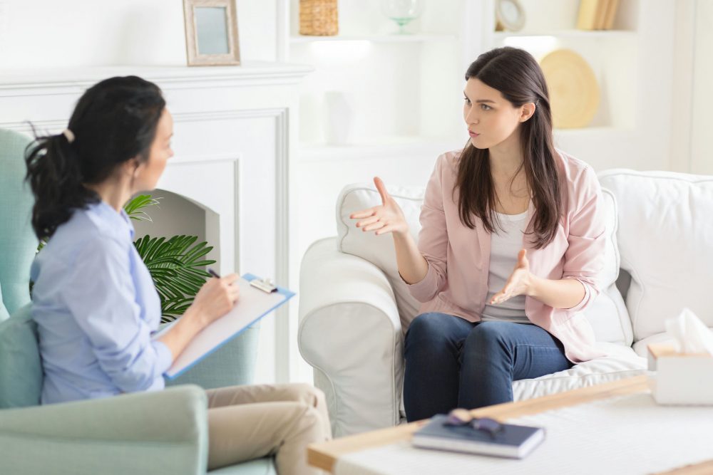 Woman consulting with therapist about how to prepare for rehab.